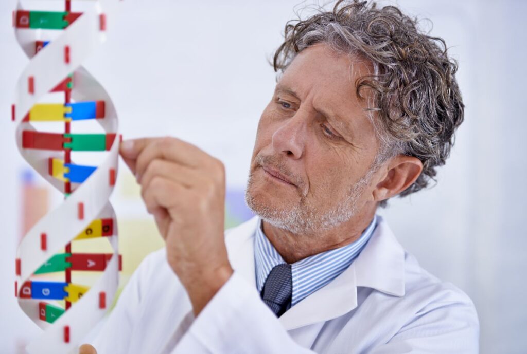 a scientist studying a strand of dna for the achy gene